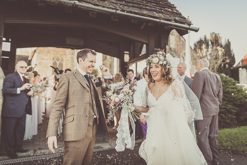 The bride wears YolanCris for her rustic, late Autumn barn wedding at Ramster Hall in Chiddingford, Surrey. Photography by Michelle Lindsell.