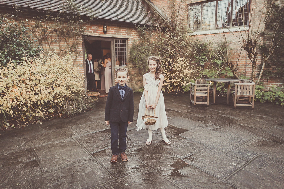 The bride wears YolanCris for her rustic, late Autumn barn wedding at Ramster Hall in Chiddingford, Surrey. Photography by Michelle Lindsell.