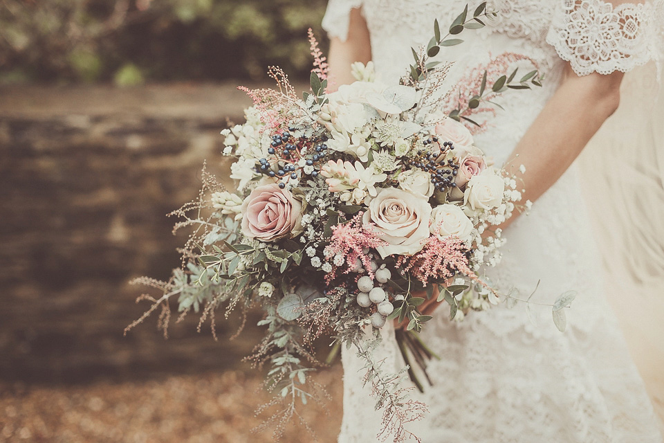 The bride wears YolanCris for her rustic, late Autumn barn wedding at Ramster Hall in Chiddingford, Surrey. Photography by Michelle Lindsell.