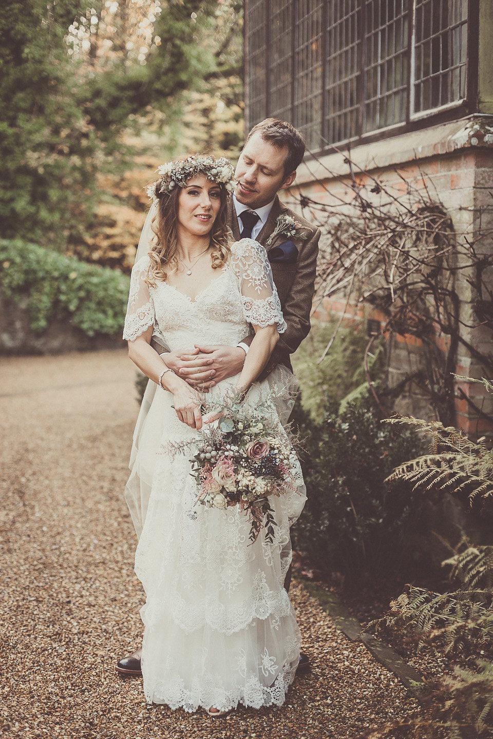 The bride wears YolanCris for her rustic, late Autumn barn wedding at Ramster Hall in Chiddingford, Surrey. Photography by Michelle Lindsell.