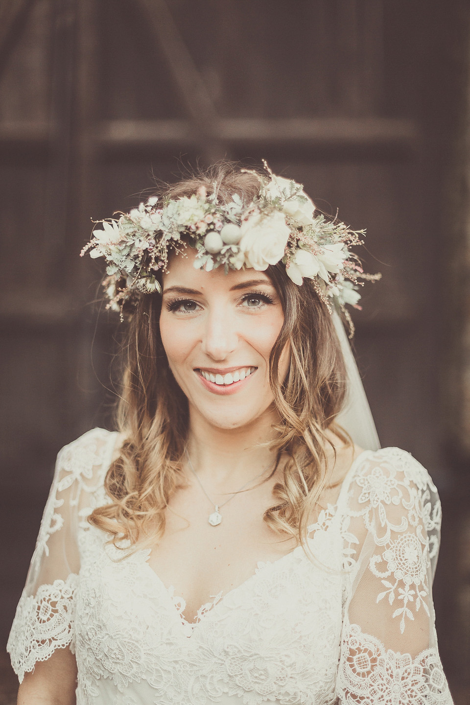 The bride wears YolanCris for her rustic, late Autumn barn wedding at Ramster Hall in Chiddingford, Surrey. Photography by Michelle Lindsell.