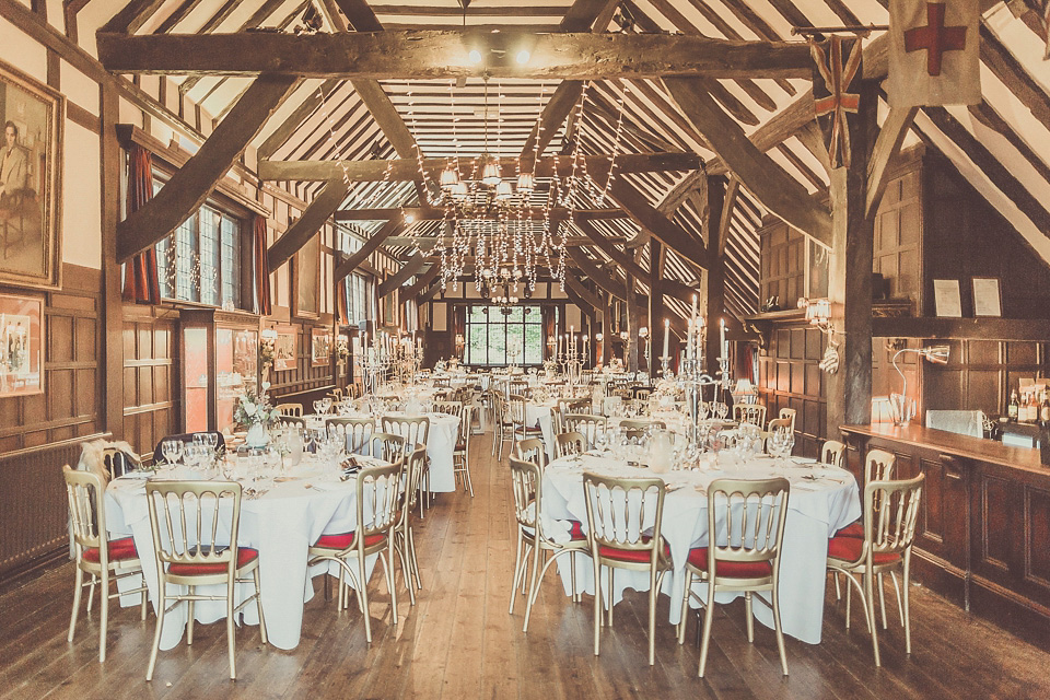 The bride wears YolanCris for her rustic, late Autumn barn wedding at Ramster Hall in Chiddingford, Surrey. Photography by Michelle Lindsell.