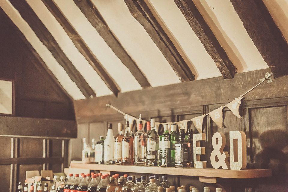 The bride wears YolanCris for her rustic, late Autumn barn wedding at Ramster Hall in Chiddingford, Surrey. Photography by Michelle Lindsell.