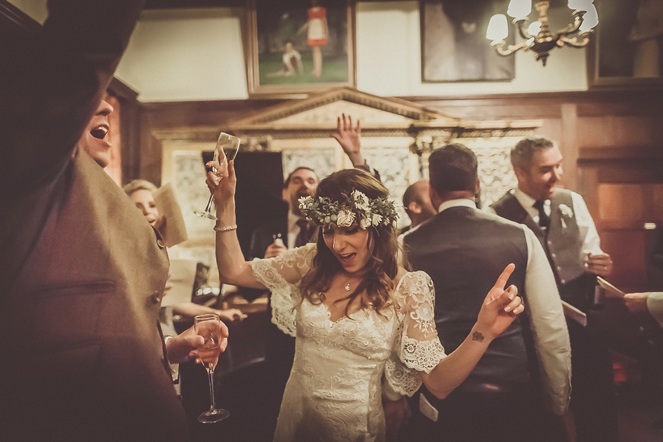 The bride wears YolanCris for her rustic, late Autumn barn wedding at Ramster Hall in Chiddingford, Surrey. Photography by Michelle Lindsell.