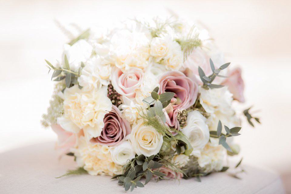 A blush pink and rose gold wedding at Northbrook Park in Surrey. Photography by Naomi Kenton. The bride wears Bridal Rosa Couture from The Bridal Rooms of Worcester.