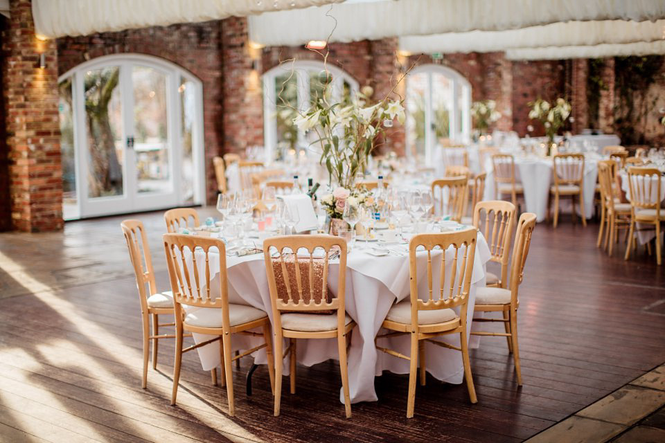 A blush pink and rose gold wedding at Northbrook Park in Surrey. Photography by Naomi Kenton. The bride wears Bridal Rosa Couture from The Bridal Rooms of Worcester.