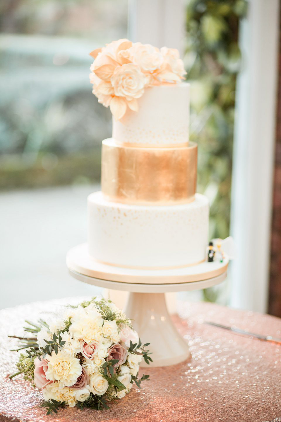 A blush pink and rose gold wedding at Northbrook Park in Surrey. Photography by Naomi Kenton. The bride wears Bridal Rosa Couture from The Bridal Rooms of Worcester.