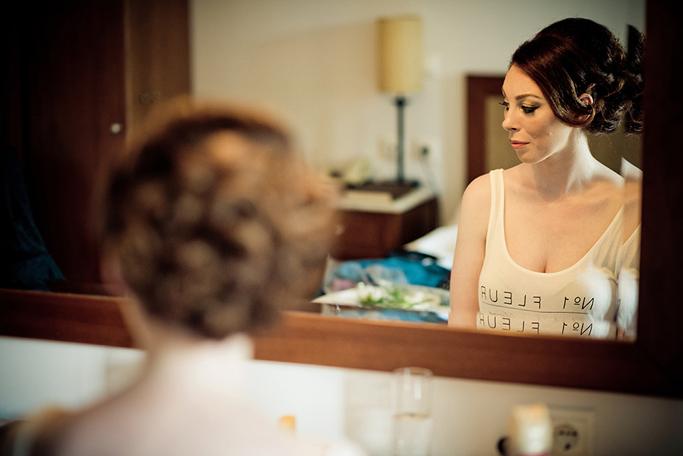 A destinatoin wedding in Zakynthos, Greece. The bride wears Ronald Joyce and her maids wear twobirds Bridesmaid.  Photography by Nick Kontostavlakis.