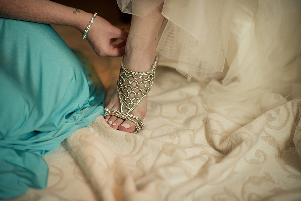 A destinatoin wedding in Zakynthos, Greece. The bride wears Ronald Joyce and her maids wear twobirds Bridesmaid.  Photography by Nick Kontostavlakis.