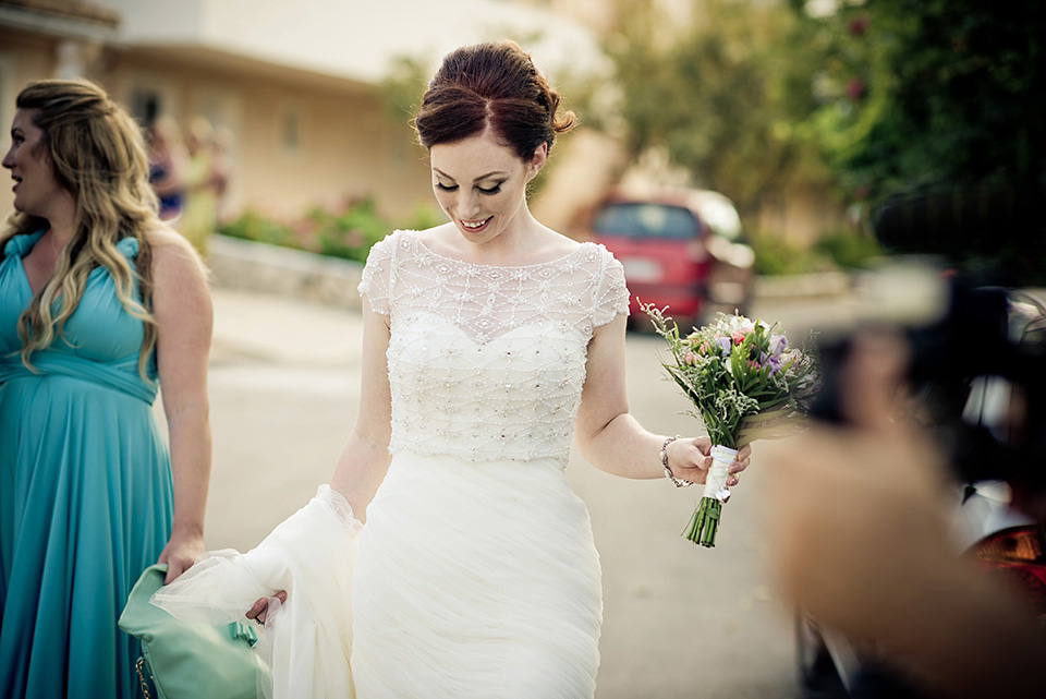 A destinatoin wedding in Zakynthos, Greece. The bride wears Ronald Joyce and her maids wear twobirds Bridesmaid.  Photography by Nick Kontostavlakis.