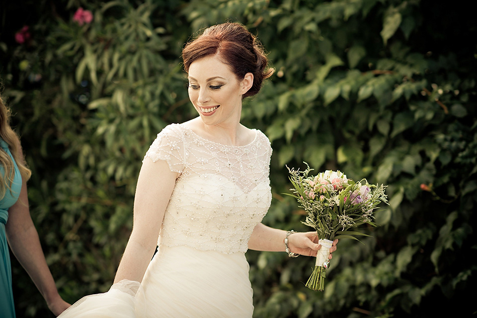 A destinatoin wedding in Zakynthos, Greece. The bride wears Ronald Joyce and her maids wear twobirds Bridesmaid.  Photography by Nick Kontostavlakis.