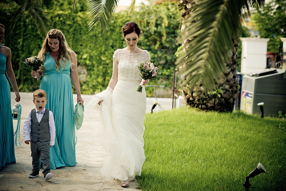 A destinatoin wedding in Zakynthos, Greece. The bride wears Ronald Joyce and her maids wear twobirds Bridesmaid.  Photography by Nick Kontostavlakis.