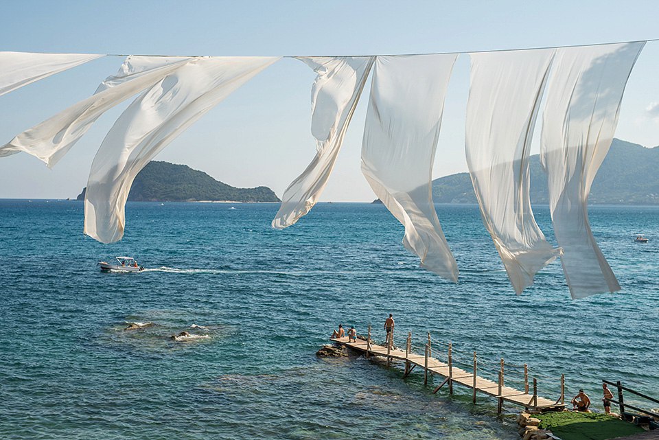 A destinatoin wedding in Zakynthos, Greece. The bride wears Ronald Joyce and her maids wear twobirds Bridesmaid.  Photography by Nick Kontostavlakis.