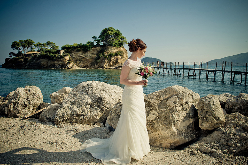 A destinatoin wedding in Zakynthos, Greece. The bride wears Ronald Joyce and her maids wear twobirds Bridesmaid.  Photography by Nick Kontostavlakis.