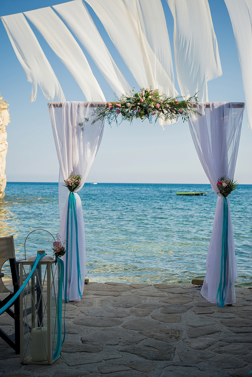 A destinatoin wedding in Zakynthos, Greece. The bride wears Ronald Joyce and her maids wear twobirds Bridesmaid.  Photography by Nick Kontostavlakis.