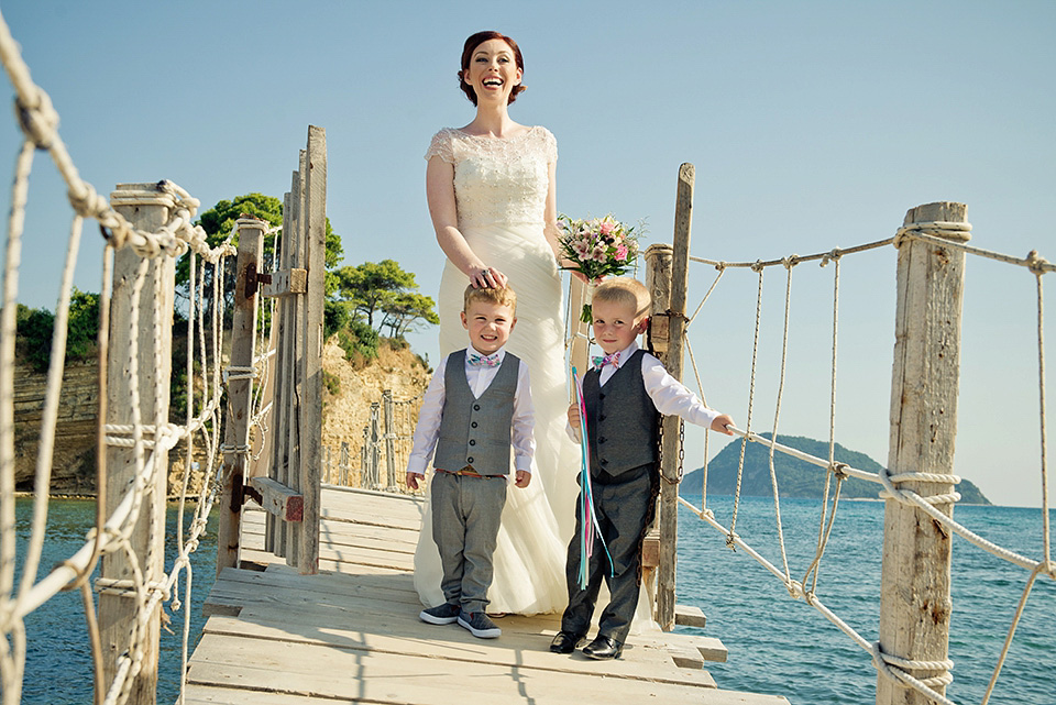 A destinatoin wedding in Zakynthos, Greece. The bride wears Ronald Joyce and her maids wear twobirds Bridesmaid.  Photography by Nick Kontostavlakis.