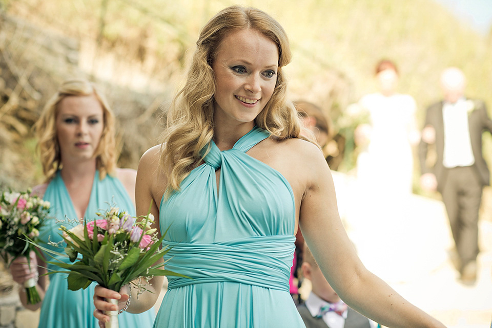 A destinatoin wedding in Zakynthos, Greece. The bride wears Ronald Joyce and her maids wear twobirds Bridesmaid.  Photography by Nick Kontostavlakis.