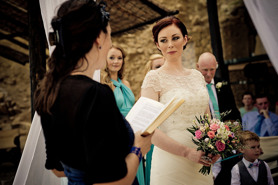 A destinatoin wedding in Zakynthos, Greece. The bride wears Ronald Joyce and her maids wear twobirds Bridesmaid.  Photography by Nick Kontostavlakis.