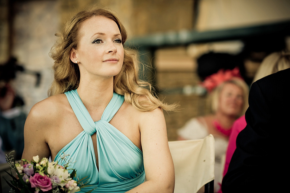 A destinatoin wedding in Zakynthos, Greece. The bride wears Ronald Joyce and her maids wear twobirds Bridesmaid.  Photography by Nick Kontostavlakis.