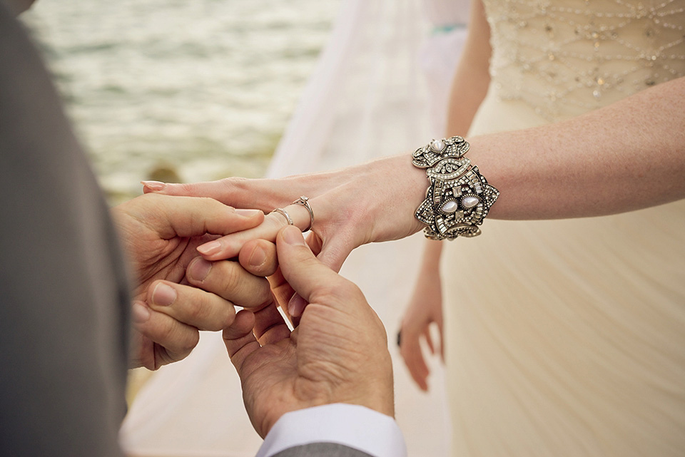 A destinatoin wedding in Zakynthos, Greece. The bride wears Ronald Joyce and her maids wear twobirds Bridesmaid.  Photography by Nick Kontostavlakis.