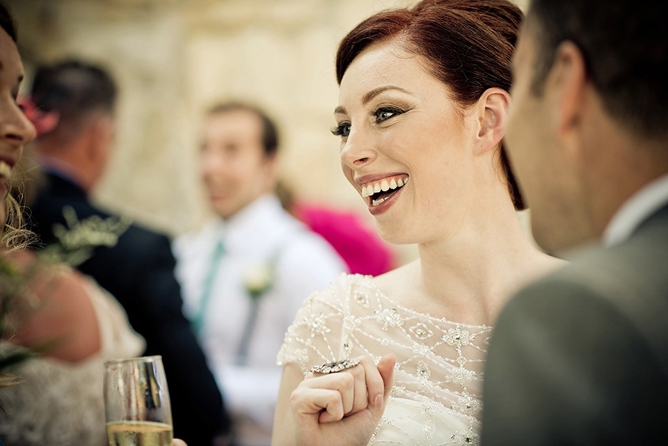 A destinatoin wedding in Zakynthos, Greece. The bride wears Ronald Joyce and her maids wear twobirds Bridesmaid.  Photography by Nick Kontostavlakis.