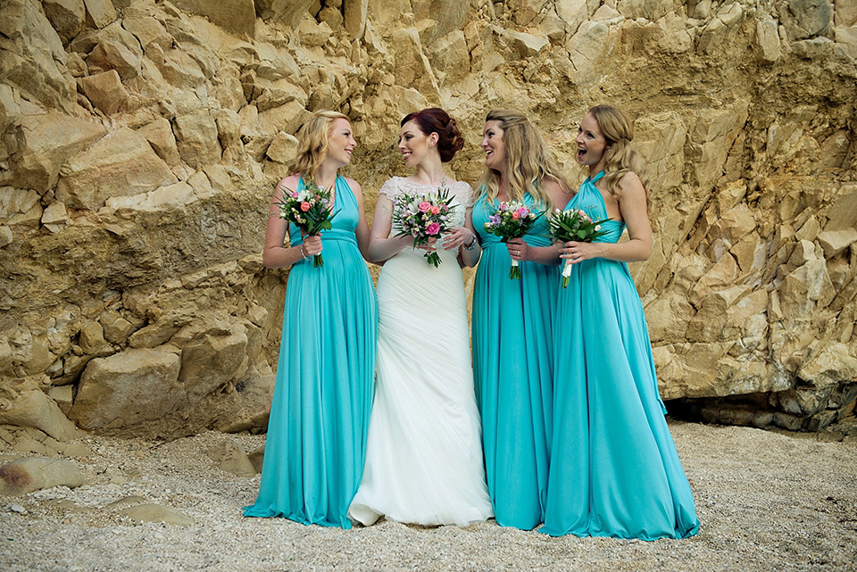 A destinatoin wedding in Zakynthos, Greece. The bride wears Ronald Joyce and her maids wear twobirds Bridesmaid.  Photography by Nick Kontostavlakis.