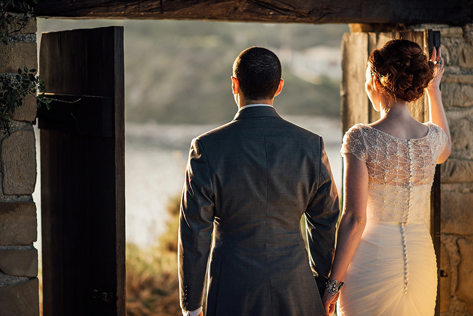 A destinatoin wedding in Zakynthos, Greece. The bride wears Ronald Joyce and her maids wear twobirds Bridesmaid.  Photography by Nick Kontostavlakis.