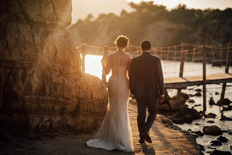 A destinatoin wedding in Zakynthos, Greece. The bride wears Ronald Joyce and her maids wear twobirds Bridesmaid.  Photography by Nick Kontostavlakis.