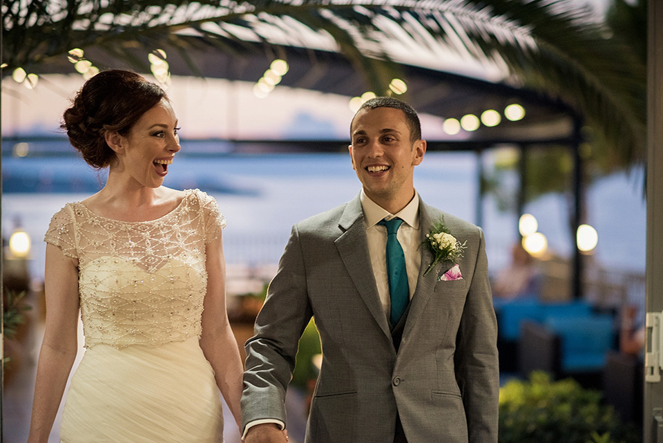 A destinatoin wedding in Zakynthos, Greece. The bride wears Ronald Joyce and her maids wear twobirds Bridesmaid.  Photography by Nick Kontostavlakis.