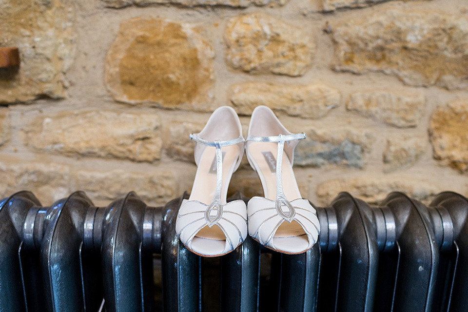 An elegant English wedding in the Spring. The bride wears Kristene by Claire Pettibone. Photography by Jo Hastings.