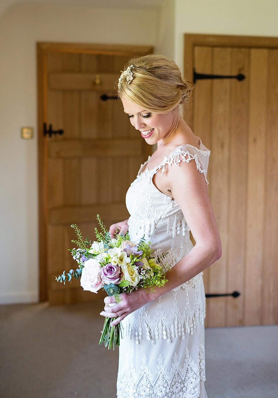 An elegant English wedding in the Spring. The bride wears Kristene by Claire Pettibone. Photography by Jo Hastings.