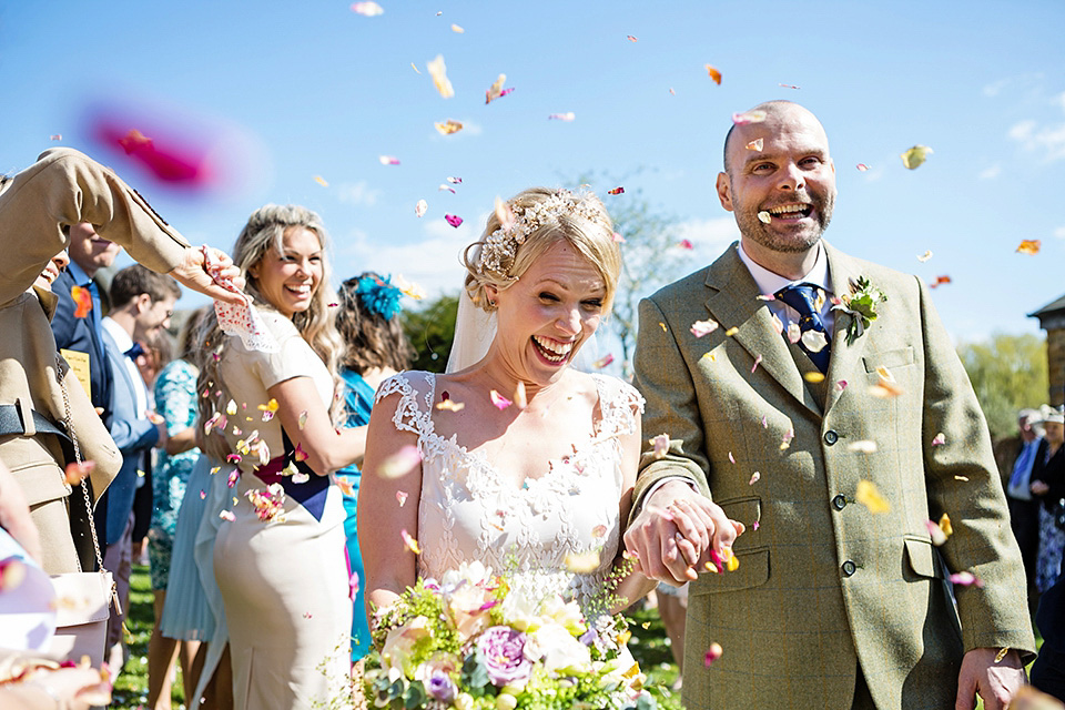 An elegant English wedding in the Spring. The bride wears Kristene by Claire Pettibone. Photography by Jo Hastings.