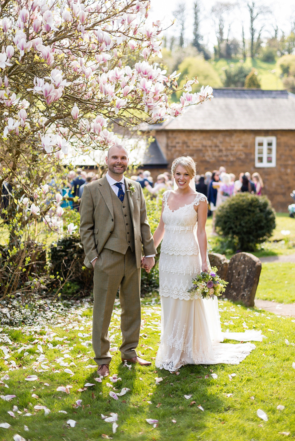 An elegant English wedding in the Spring. The bride wears Kristene by Claire Pettibone. Photography by Jo Hastings.
