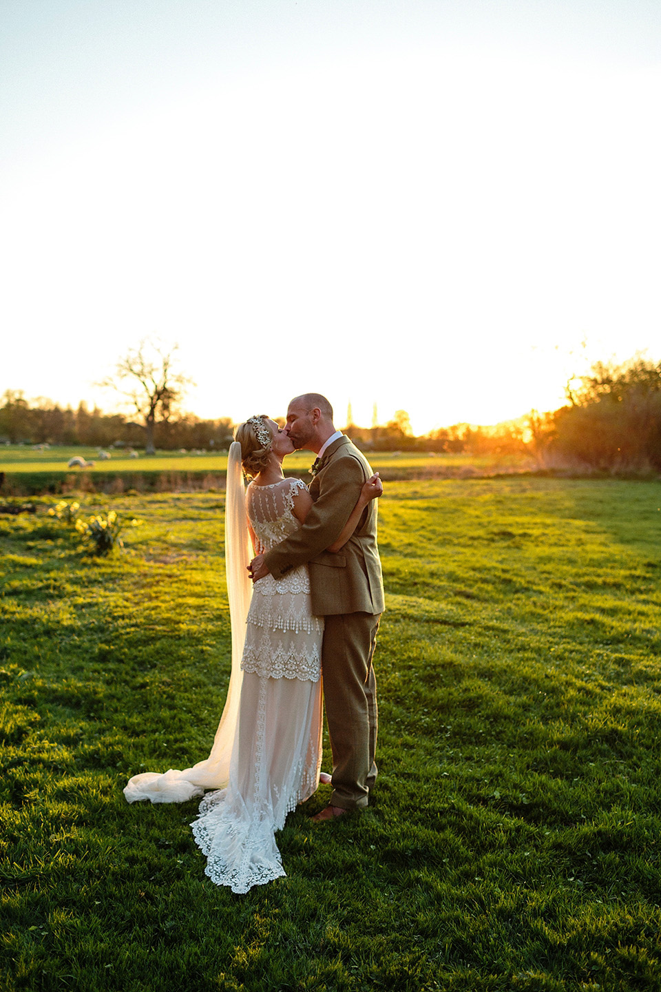 An elegant English wedding in the Spring. The bride wears Kristene by Claire Pettibone. Photography by Jo Hastings.