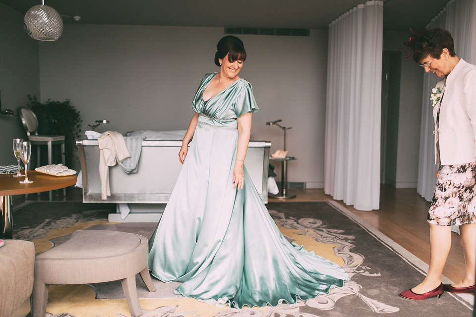 A pale green silk dress by The State of Grace, for an elegant London Wedding. Photography by Lee Garland.