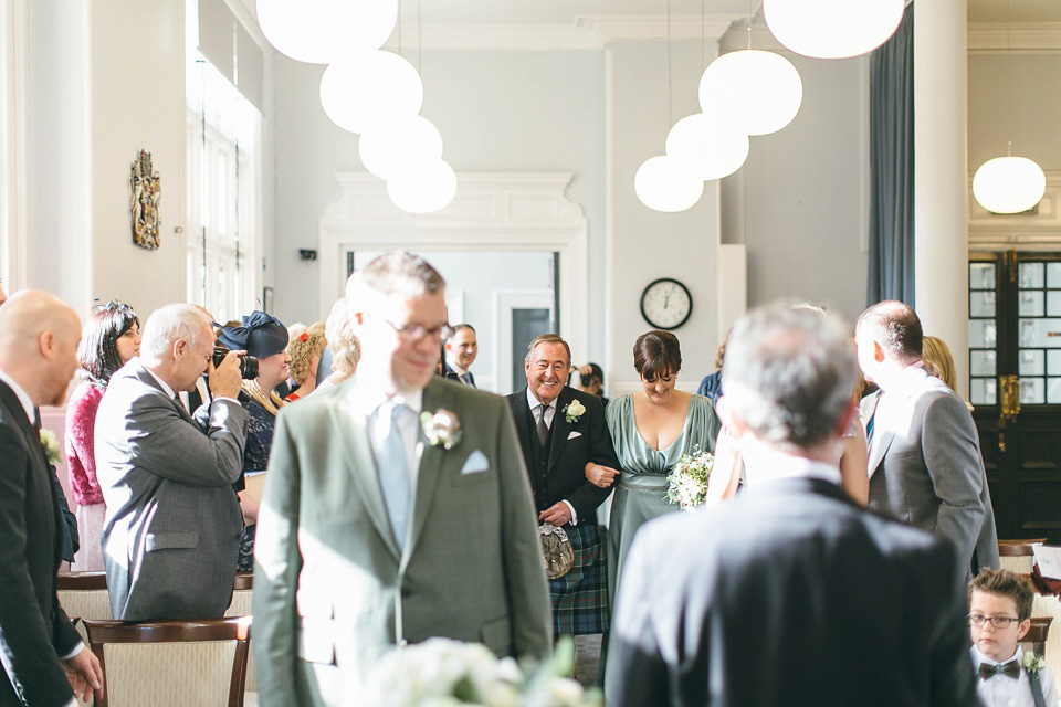 A pale green silk dress by The State of Grace, for an elegant London Wedding. Photography by Lee Garland.