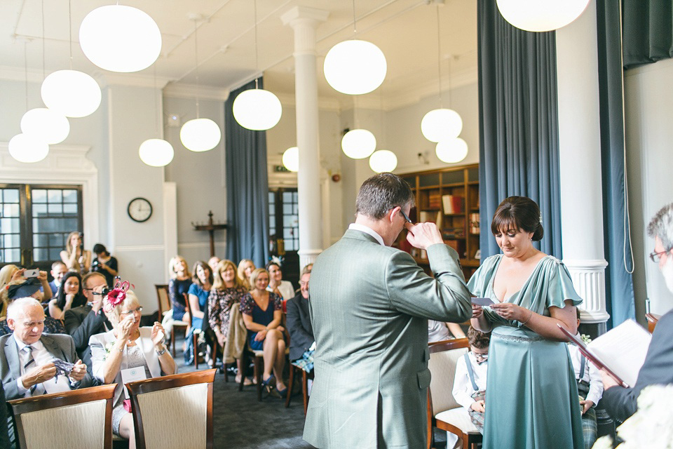 A pale green silk dress by The State of Grace, for an elegant London Wedding. Photography by Lee Garland.