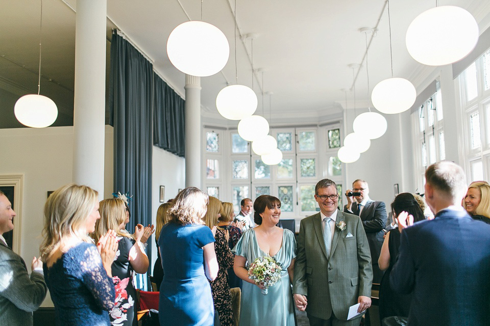 A pale green silk dress by The State of Grace, for an elegant London Wedding. Photography by Lee Garland.