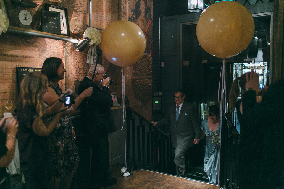 A pale green silk dress by The State of Grace, for an elegant London Wedding. Photography by Lee Garland.