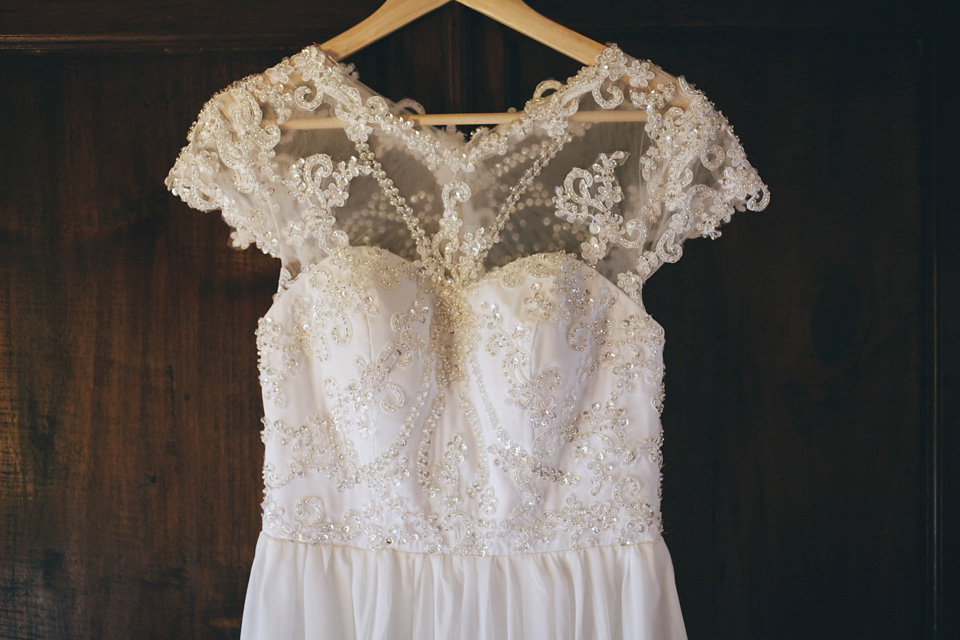 An elegant rustic Autumn wedding with a bride wearing flowers in her hair. Photography by Sally T.