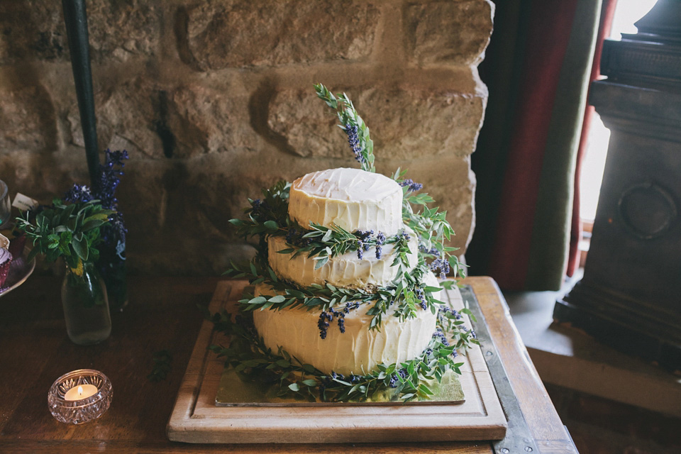 An elegant rustic Autumn wedding with a bride wearing flowers in her hair. Photography by Sally T.