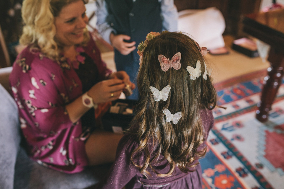 An elegant rustic Autumn wedding with a bride wearing flowers in her hair. Photography by Sally T.