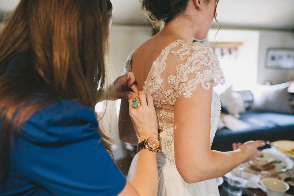 An elegant rustic Autumn wedding with a bride wearing flowers in her hair. Photography by Sally T.