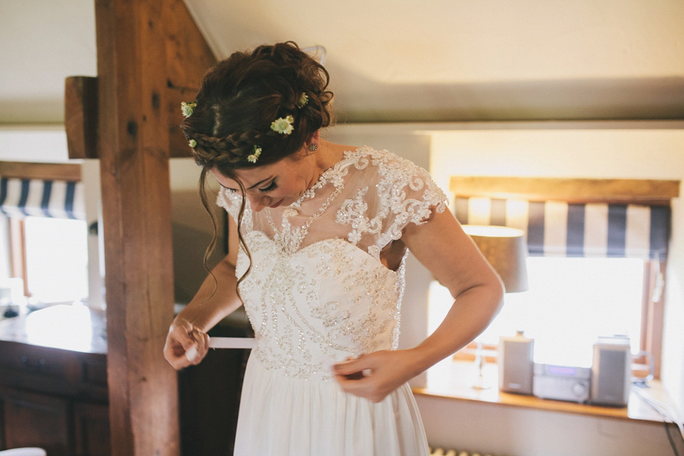 An elegant rustic Autumn wedding with a bride wearing flowers in her hair. Photography by Sally T.