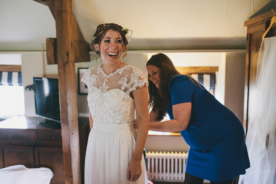 An elegant rustic Autumn wedding with a bride wearing flowers in her hair. Photography by Sally T.