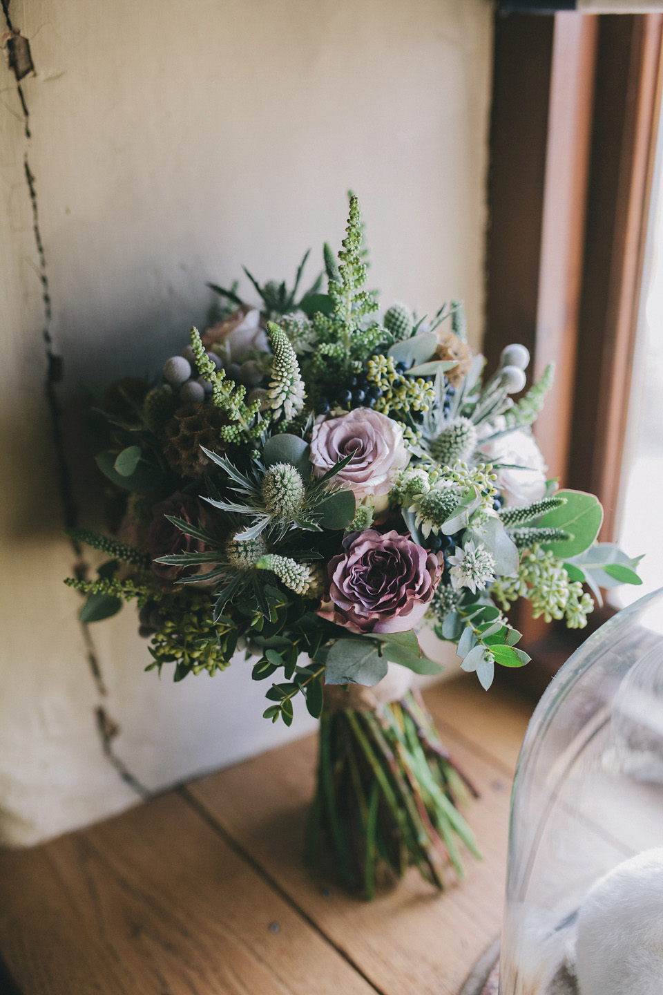 An elegant rustic Autumn wedding with a bride wearing flowers in her hair. Photography by Sally T.