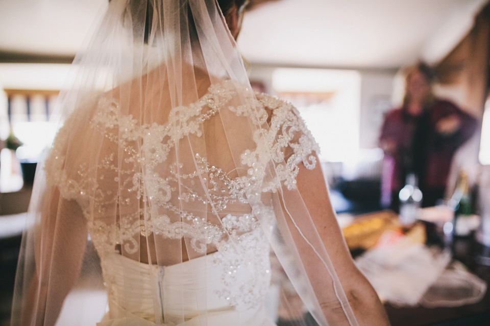 An elegant rustic Autumn wedding with a bride wearing flowers in her hair. Photography by Sally T.