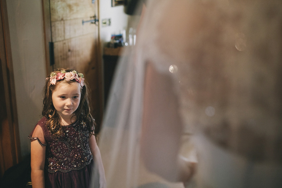 An elegant rustic Autumn wedding with a bride wearing flowers in her hair. Photography by Sally T.