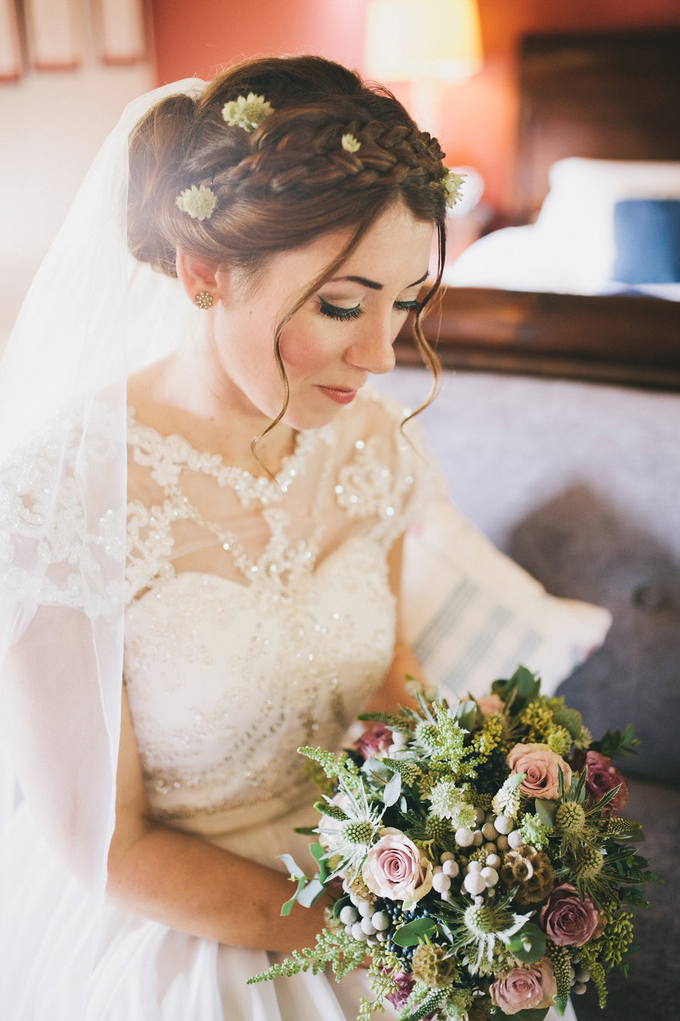 An elegant rustic Autumn wedding with a bride wearing flowers in her hair. Photography by Sally T.