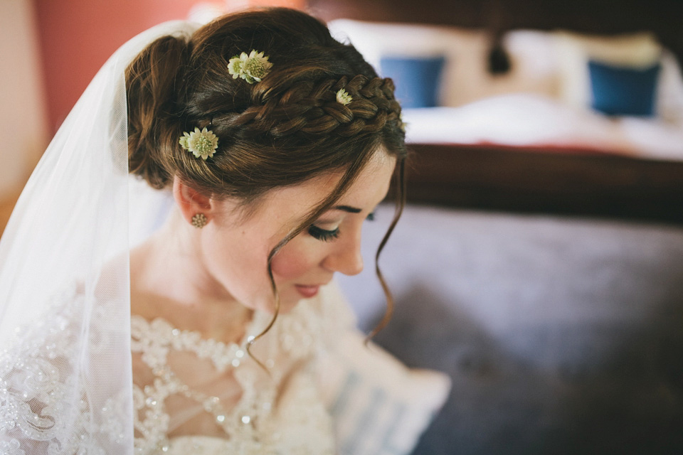 An elegant rustic Autumn wedding with a bride wearing flowers in her hair. Photography by Sally T.